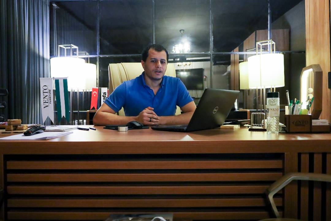 a man sitting in the office